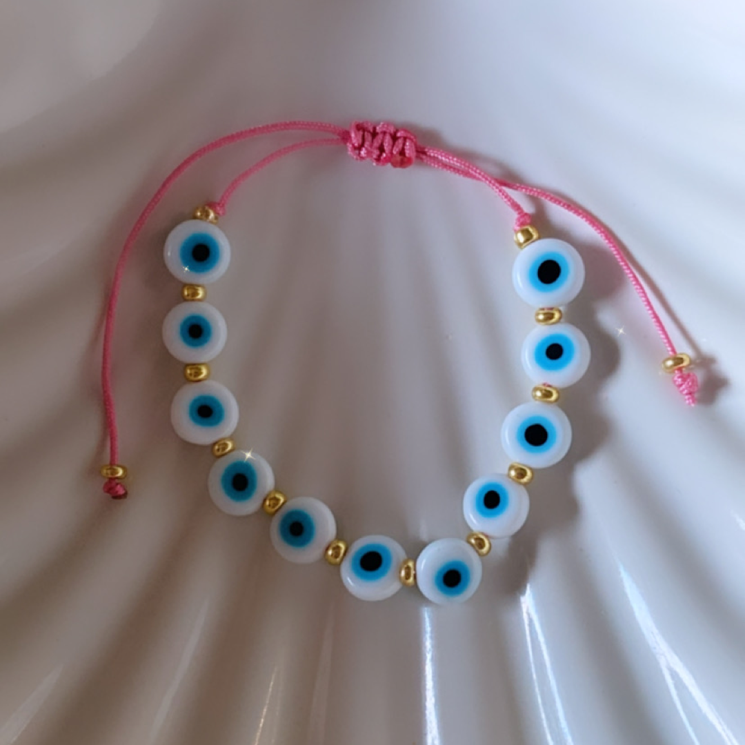 White ojito with pink adult bracelet