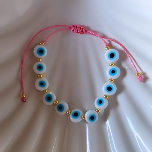 White ojito with pink adult bracelet