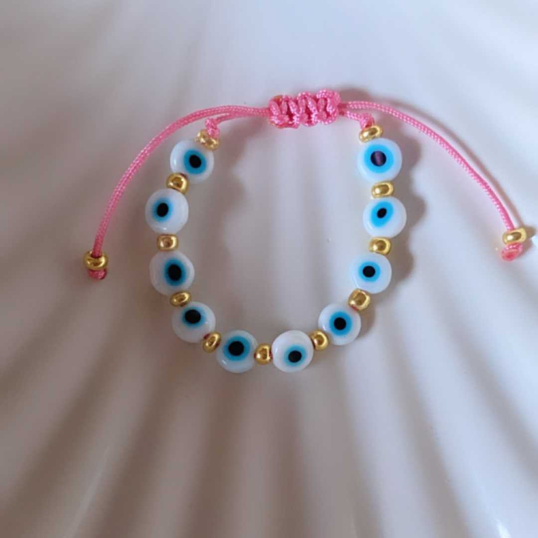White ojito with pink baby bracelet